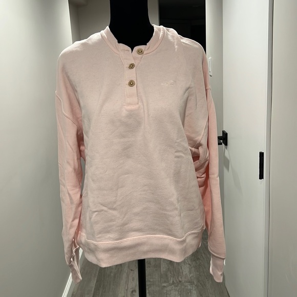 Hollister light pink sweatshirt with buttons halfway down the front. Size XS. - Picture 1 of 2